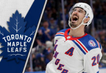 New York Rangers forward Chris Kreider skates with the puck, a potential trade target for the Toronto Maple Leafs.