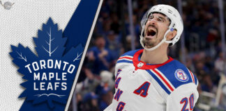 New York Rangers forward Chris Kreider skates with the puck, a potential trade target for the Toronto Maple Leafs.