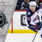 Dante Fabbro, right-shot defenseman, skating in his Columbus Blue Jackets jersey, amidst NHL trade rumors.