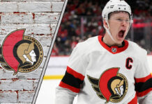 Brady Tkachuk skating as Ottawa Senators captain during NHL playoff game