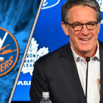 Brendan Shanahan in a suit, with the Toronto Maple Leafs logo subtly blurred in the background, facing a New York Islanders logo.