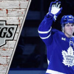 Toronto Maple Leafs forward Mitch Marner skates with the puck, amidst swirling trade rumors connecting him to the LA Kings.