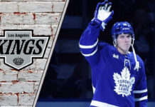 Toronto Maple Leafs forward Mitch Marner skates with the puck, amidst swirling trade rumors connecting him to the LA Kings.