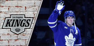 Toronto Maple Leafs forward Mitch Marner skates with the puck, amidst swirling trade rumors connecting him to the LA Kings.