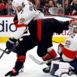 Action shot from the NHL playoff series between the Florida Panthers and Carolina Hurricanes in May 2025.