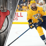 Ryan O’Reilly trade rumor with New Jersey Devils logo and Nashville Predators background