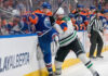 Edmonton Oilers and Dallas Stars logos clashing with a hockey puck, symbolizing their Game 2 playoff matchup on May 23 2025.