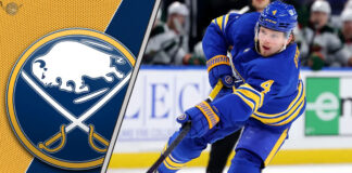 Buffalo Sabres defenseman Bowen Byram skates during an NHL game, with intense focus as NHL trade rumors swirl around his future.
