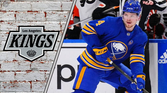 Why the Kings Would Bite on a Byram Deal An action shot of Buffalo Sabres defenseman Bowen Byram skating with the puck, with a subtle Los Angeles Kings logo in the background.