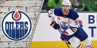 Edmonton Oilers captain Connor McDavid looks on thoughtfully during a game, contemplating his future contract extension.