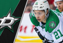 Dallas Stars forward Jason Robertson taking a faceoff during an NHL game, with NHL trade rumors swirling around his future with the team.
