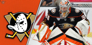 Anaheim Ducks goalie John Gibson makes a save, looking focused in his net.