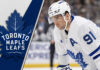 Toronto Maple Leafs forward John Tavares skates during a game, focused on the play, representing the latest Toronto Maple Leafs news.