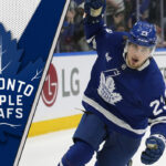 Matthew Knies celebrating a goal in his Toronto Maple Leafs jersey during the 2024-25 NHL season.