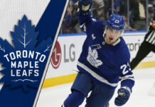 Matthew Knies celebrating a goal in his Toronto Maple Leafs jersey during the 2024-25 NHL season.