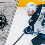 The Nikolaj Ehlers Sweepstakes: Which 5 Teams Are Gearing Up for a Bidding War? Winnipeg Jets forward Nikolaj Ehlers skates with the puck, looking for a scoring opportunity, amidst swirling NHL trade rumors.