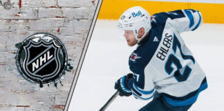 Winnipeg Jets forward Nikolaj Ehlers skates with the puck, looking for a scoring opportunity, amidst swirling NHL trade rumors.