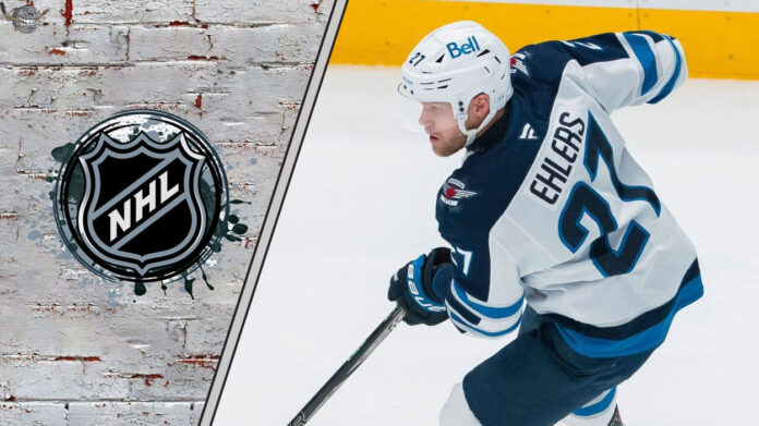 Winnipeg Jets forward Nikolaj Ehlers skates with the puck, looking for a scoring opportunity, amidst swirling NHL trade rumors.