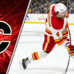 NHL Rumor Mill Spinning: Rasmus Andersson Trade Talk Heating Up! Rasmus Andersson in a Calgary Flames jersey skates with the puck during an NHL game.