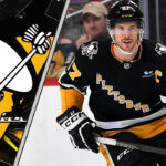 Sidney Crosby of the Pittsburgh Penguins skates with the puck during an NHL game, looking to make a play.