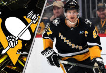 Sidney Crosby of the Pittsburgh Penguins skates with the puck during an NHL game, looking to make a play.