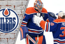 Edmonton Oilers goalie Stuart Skinner looking on from his net during an NHL game, with the Oilers logo visible on his jersey.