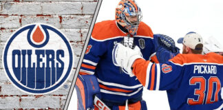 Edmonton Oilers goalie Stuart Skinner looking on from his net during an NHL game, with the Oilers logo visible on his jersey.