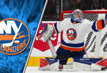 New York Islanders goaltender Ilya Sorokin makes a save, with a focused expression, amidst swirling NHL trade rumors