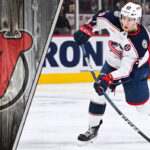 Yegor Chinakhov skates with the puck for the Columbus Blue Jackets amidst NHL trade rumors linking him to the New Jersey Devils.