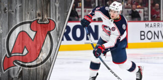 Yegor Chinakhov skates with the puck for the Columbus Blue Jackets amidst NHL trade rumors linking him to the New Jersey Devils.