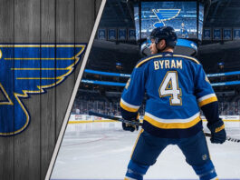 Bowen Byram in a St. Louis Blues jersey at center ice of the Enterprise Center