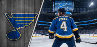 Bowen Byram in a St. Louis Blues jersey at center ice of the Enterprise Center