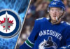 Winnipeg Jets free agent target Brock Boeser skates with the puck, amidst strong NHL trade rumors of a potential signing.