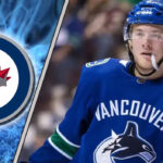 Winnipeg Jets free agent target Brock Boeser skates with the puck, amidst strong NHL trade rumors of a potential signing.