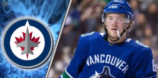 Winnipeg Jets free agent target Brock Boeser skates with the puck, amidst strong NHL trade rumors of a potential signing.