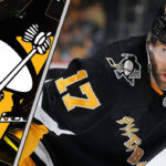 Pittsburgh Penguins forward Bryan Rust skates during an NHL game, with NHL trade rumors swirling around his future with the team.
