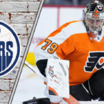 Goalie Carter Hart in his Philadelphia Flyers uniform, looking focused during a game, amidst swirling Edmonton Oilers trade rumors.