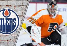 Goalie Carter Hart in his Philadelphia Flyers uniform, looking focused during a game, amidst swirling Edmonton Oilers trade rumors.