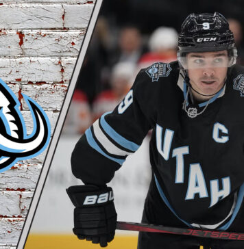 A focused Clayton Keller of the Utah Mammoth skates with the puck during an NHL game, poised for a breakout season.