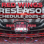 A widescreen image of the Detroit Red Wings' home arena, Little Caesars Arena, with the words "Red Wings Preseason Schedule 2025-26" in large, 3D text overlayed on the image.