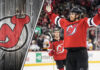 New Jersey Devils defenseman Dougie Hamilton celebrates a goal during an NHL game, amidst recent NHL trade rumors.