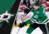 Dallas Stars forward Jason Robertson skates with the puck, with the backdrop of the arena lights, amidst ongoing contract negotiations.