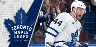 Toronto Maple Leafs defenseman Morgan Rielly looks on during a game, amidst swirling NHL trade rumors about his future.