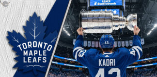 Nazem Kadri in a Toronto Maple Leafs jersey, holding the Stanley Cup at center ice.