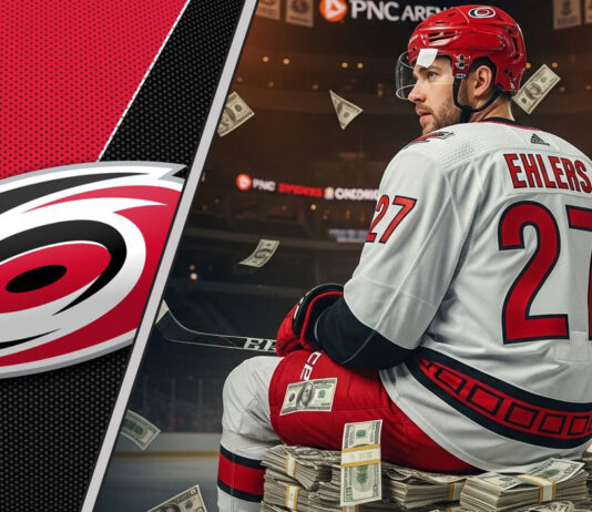 Nikolaj Ehlers in a Carolina Hurricanes jersey sitting on money at PNC Arena after signing a new contract.