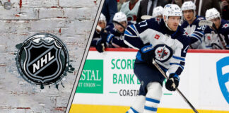 Winnipeg Jets forward Nikolaj Ehlers skates with the puck during an NHL game, looking for a passing lane.