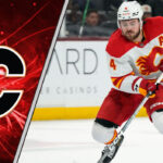 Why the Calgary Flames Are Under Pressure to Trade Rasmus Andersson Now Calgary Flames defenseman Rasmus Andersson skates with the puck during an NHL game, with a focused expression.