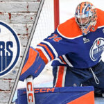 Stuart Skinner’s Next Contract: Is a Massive Payday on the Horizon? Edmonton Oilers goalie Stuart Skinner looks on during a game, focused and ready for action.