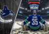 Vancouver Canucks goalie Thatcher Demko, wearing his #35 jersey, sits on top of massive stacks of money at center ice inside a full Rogers Arena.