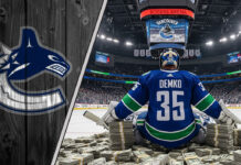 Vancouver Canucks goalie Thatcher Demko, wearing his #35 jersey, sits on top of massive stacks of money at center ice inside a full Rogers Arena.